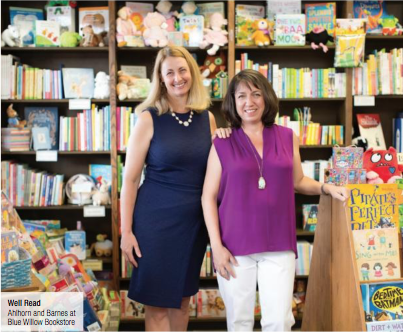 Sandra Ahlhorn and Amy Barnes standing in front of books.