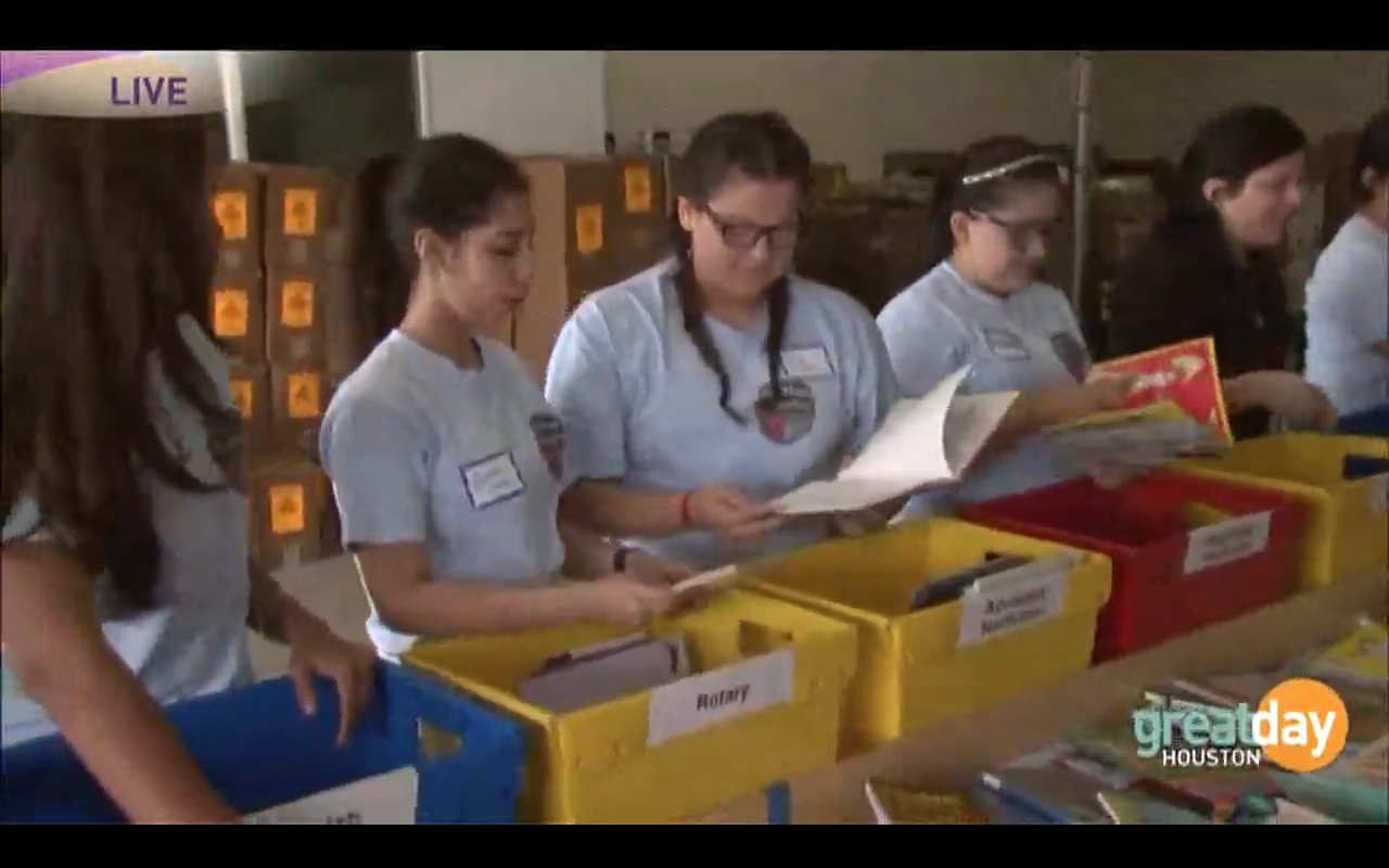 Group of volunteers sorting books.